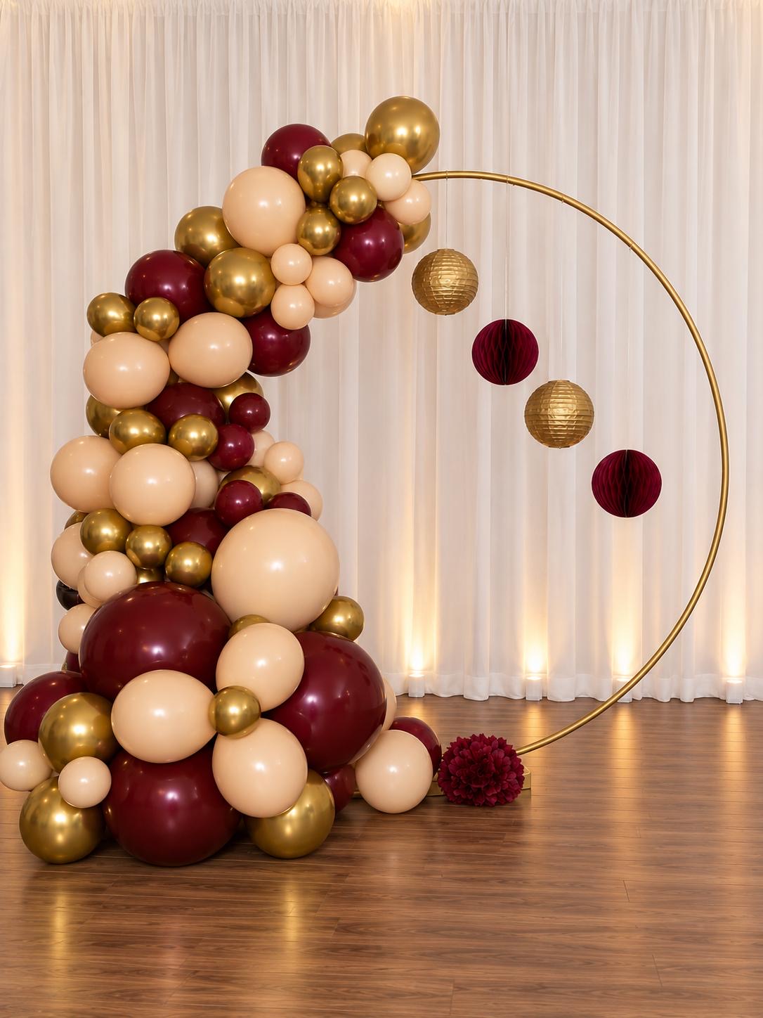 Burgundy, champagne, and gold circular balloon arch