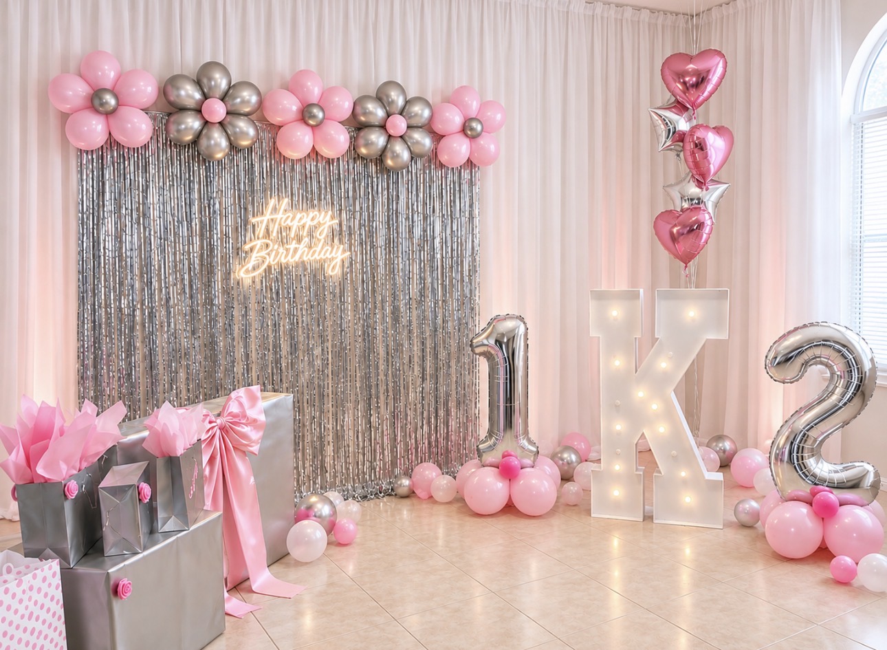 Pink and silver birthday backdrop with balloons and illuminated numbers