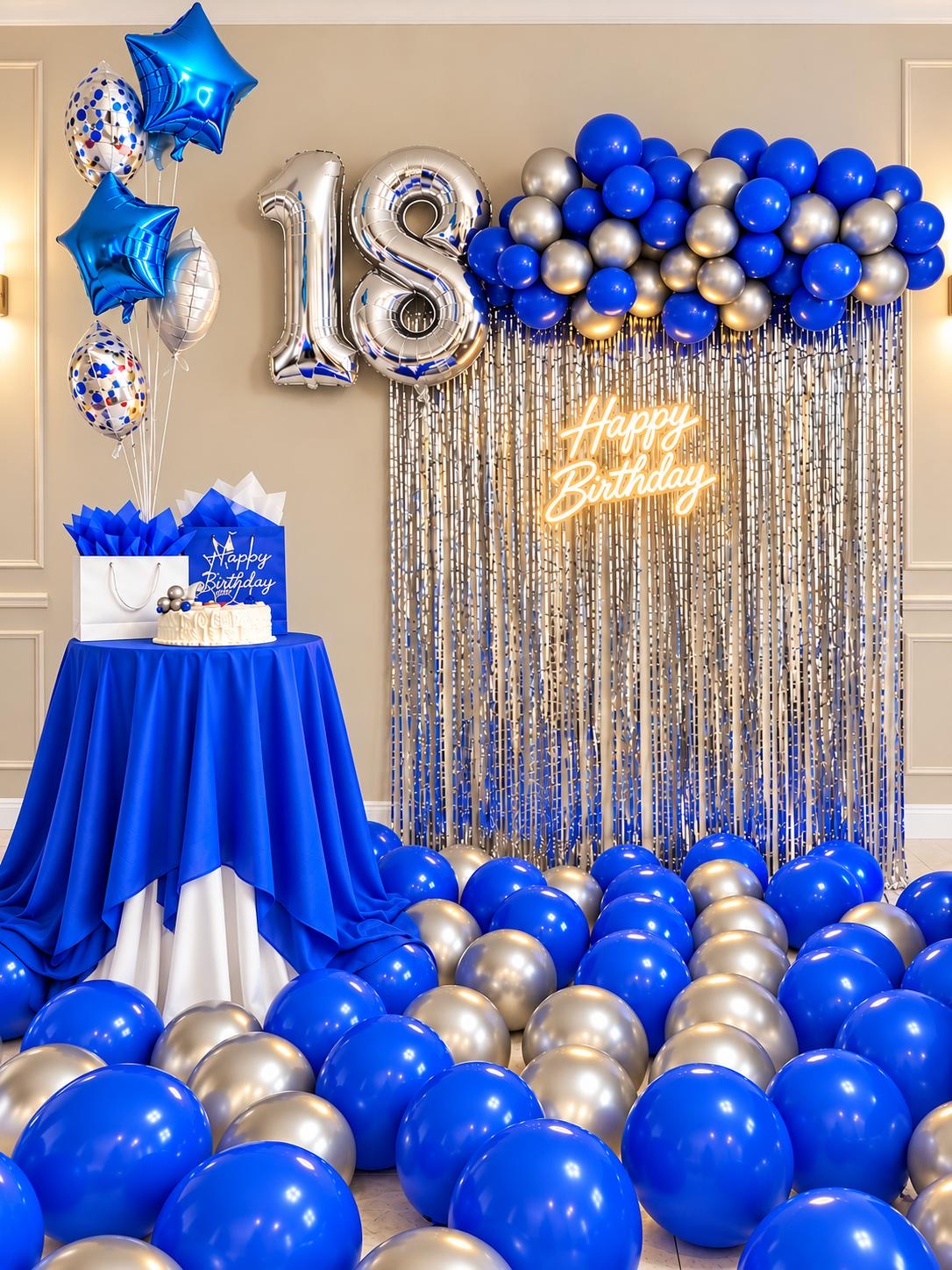 Royal blue, silver, and gold eighteenth birthday display with balloons